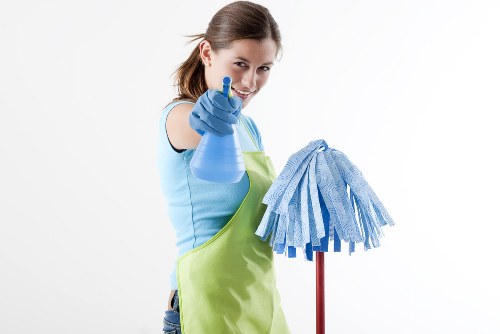Professional carpet cleaner in SW15 deep cleaning a residential carpet