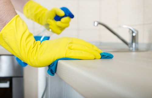 After builders cleaning service in SW15 polishing fixtures and removing builder residue from a home