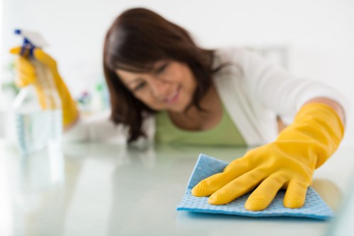 Professional oven cleaner in SW15 cleaning a built-in oven interior