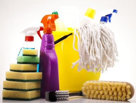 Technician using carpet cleaning machine with safety precautions