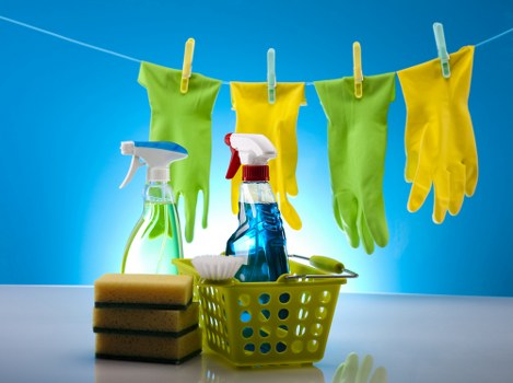 Office cleaners in SW15 sanitising shared workspaces and surfaces